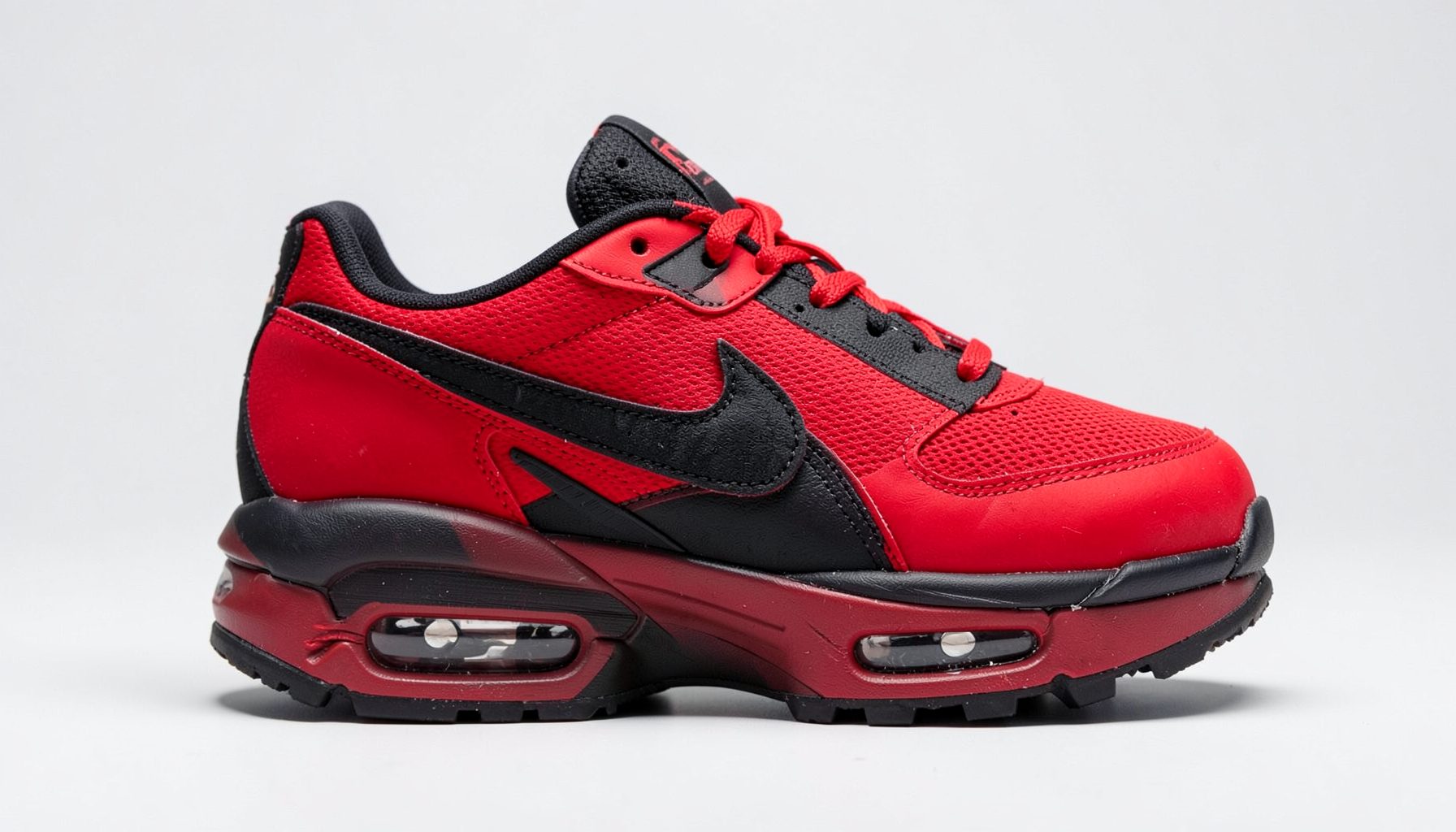 Nike Air Max 2012 shoe in red and black, bold athletic design