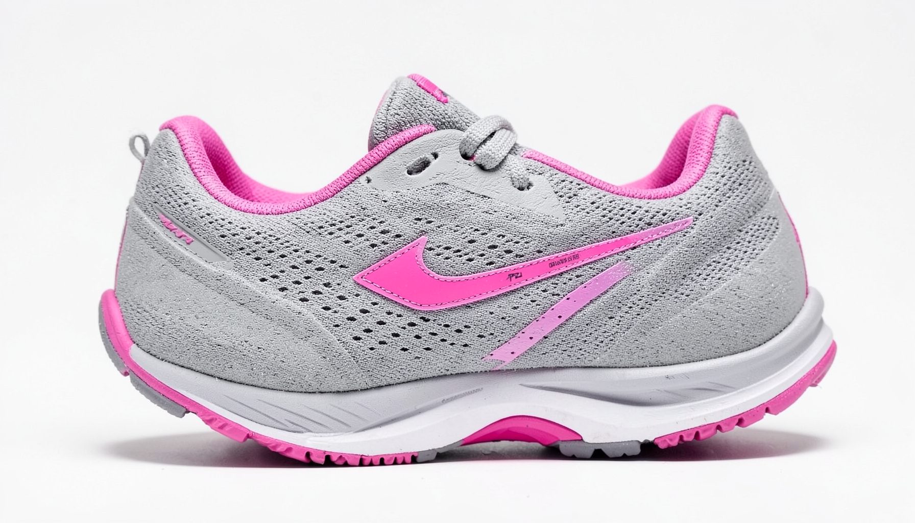 Women's running shoe in gray with fuchsia accents on the swoosh and heel