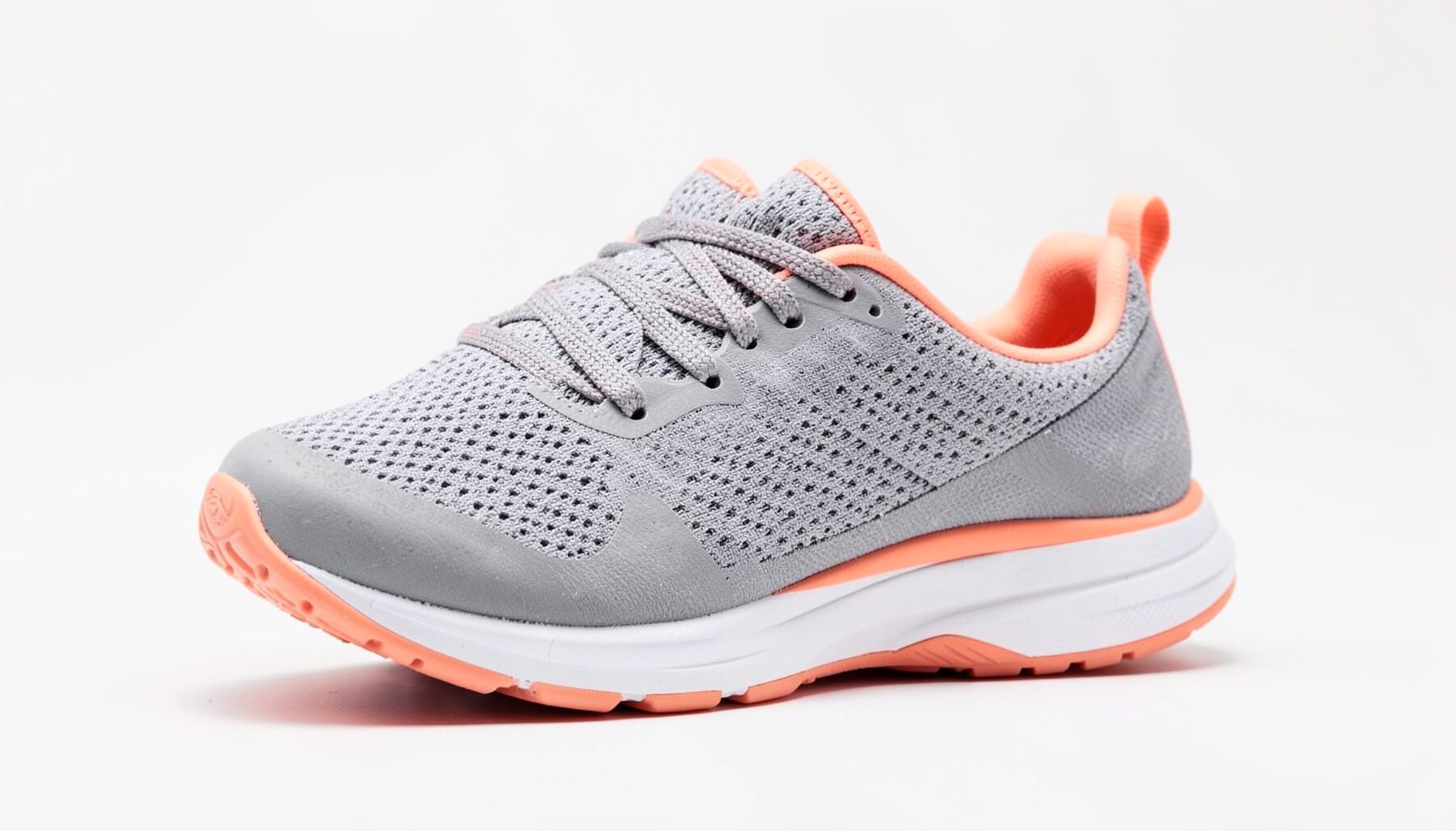 Women's running shoe in gray with peach-red accents on the heel and tongue